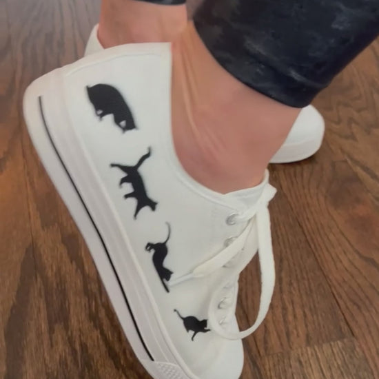 Low top sneakers with cat silhouettes